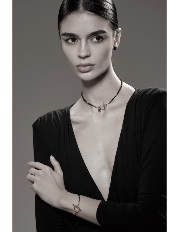 Delicate necklace with onyx stones and silver...