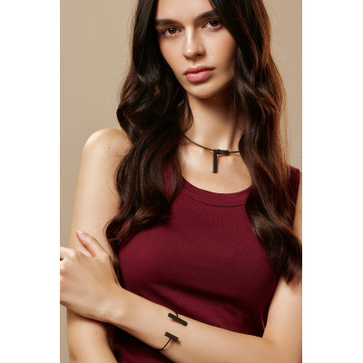 A delicate matte black stainless steel necklace with charms 2