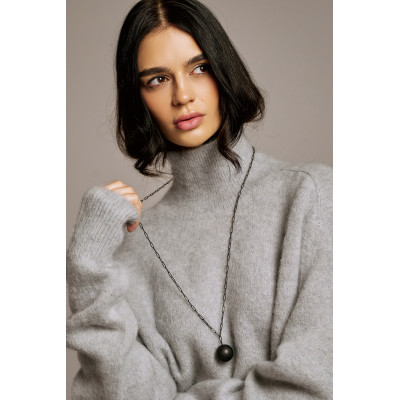 Long necklace in black matte stainless steel featuring a large decorative sphere. 2