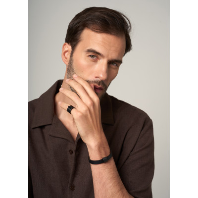 Delicate men’s leather bracelet with a matte black steel element and adjustable watch-style clasp. 2