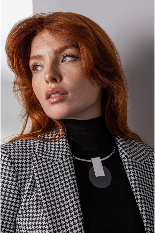 Stainless steel choker necklace with a decorative black and silver pendant 2