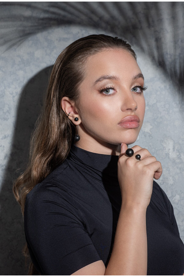 Matte black stainless steel ring with two spheres in minimalist style 2