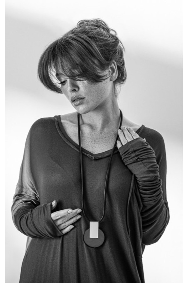 Long black leather necklace with gold-plated pendant and glossy steel elements. 2