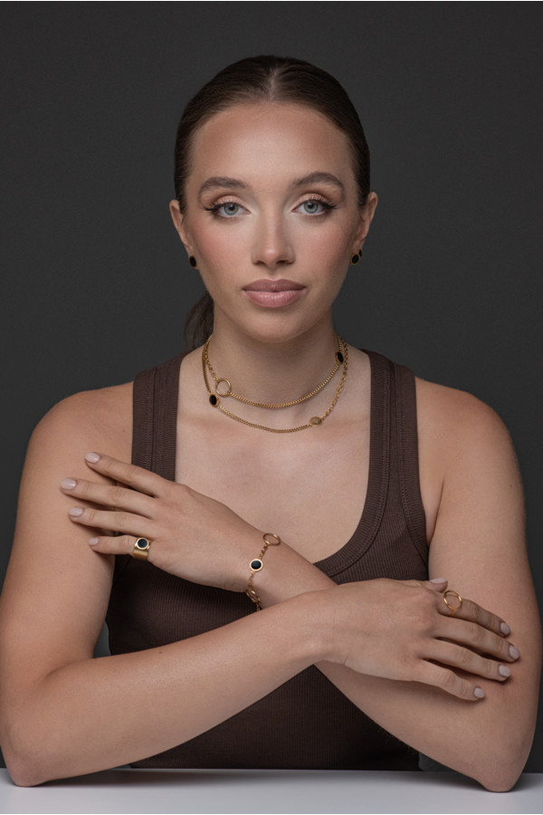 Women's gold signet ring made of matte stainless steel with a shiny black stone 2