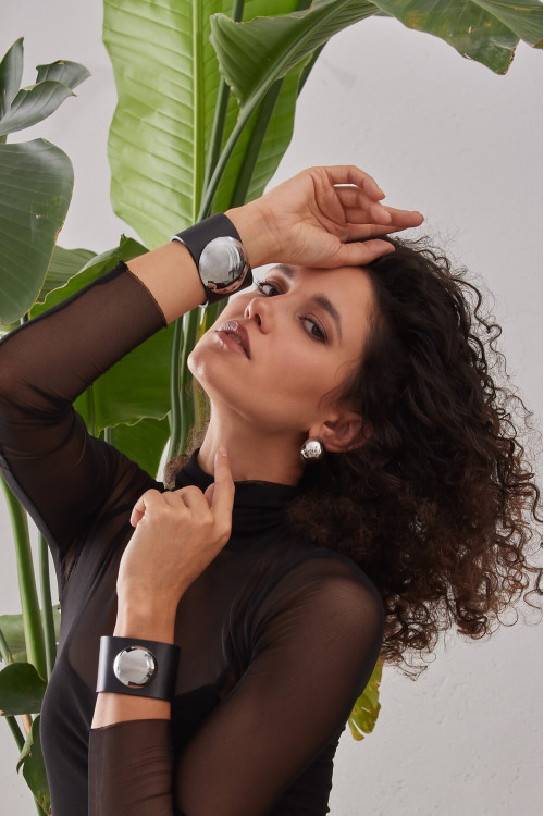 Wide black leather bracelet with polished steel dome