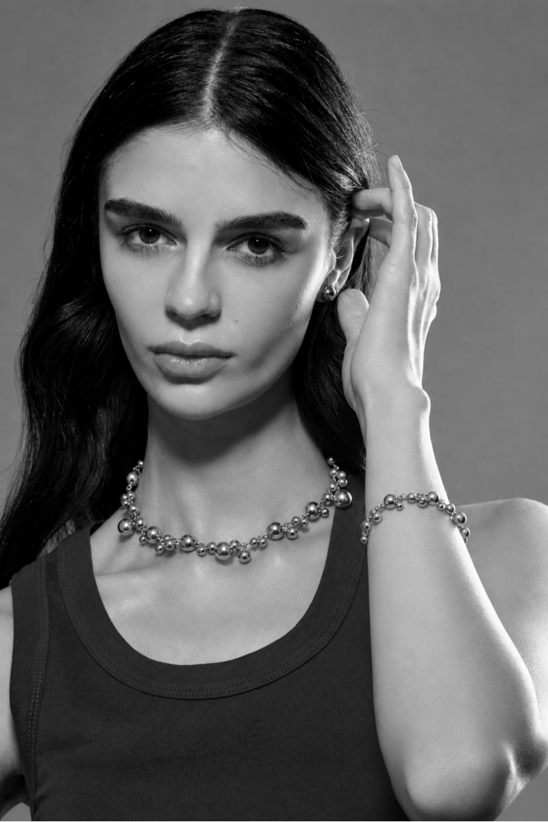 Set of silver-tone stainless steel bracelets with lobster clasps