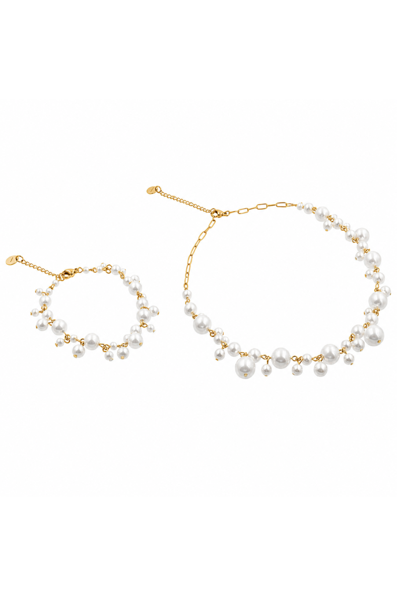 Gold-tone stainless steel pearl jewellery set with a delicate necklace and matching bracelet.