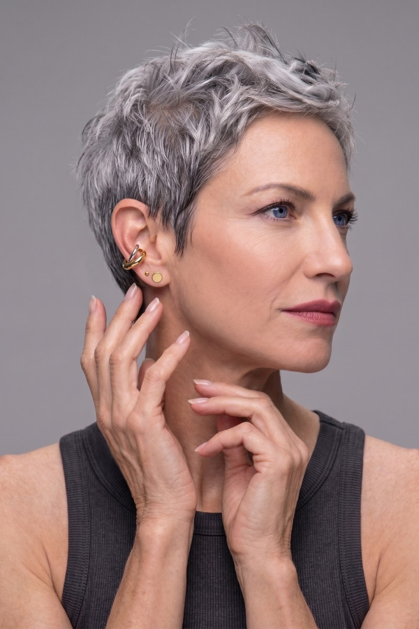 A silver and gold earring with an interwoven design, made from stainless steel 2